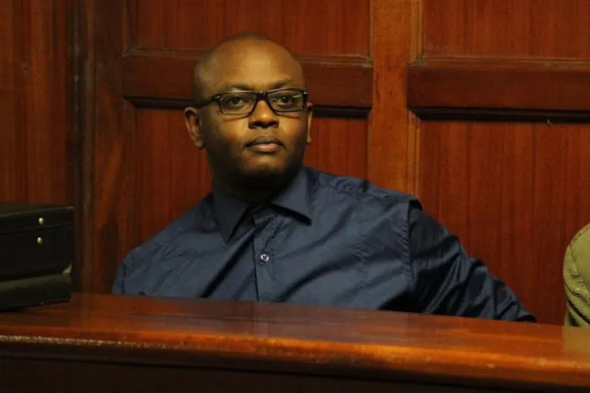 IEBC officials and Nairobi Law Courts building during tender fraud hearing